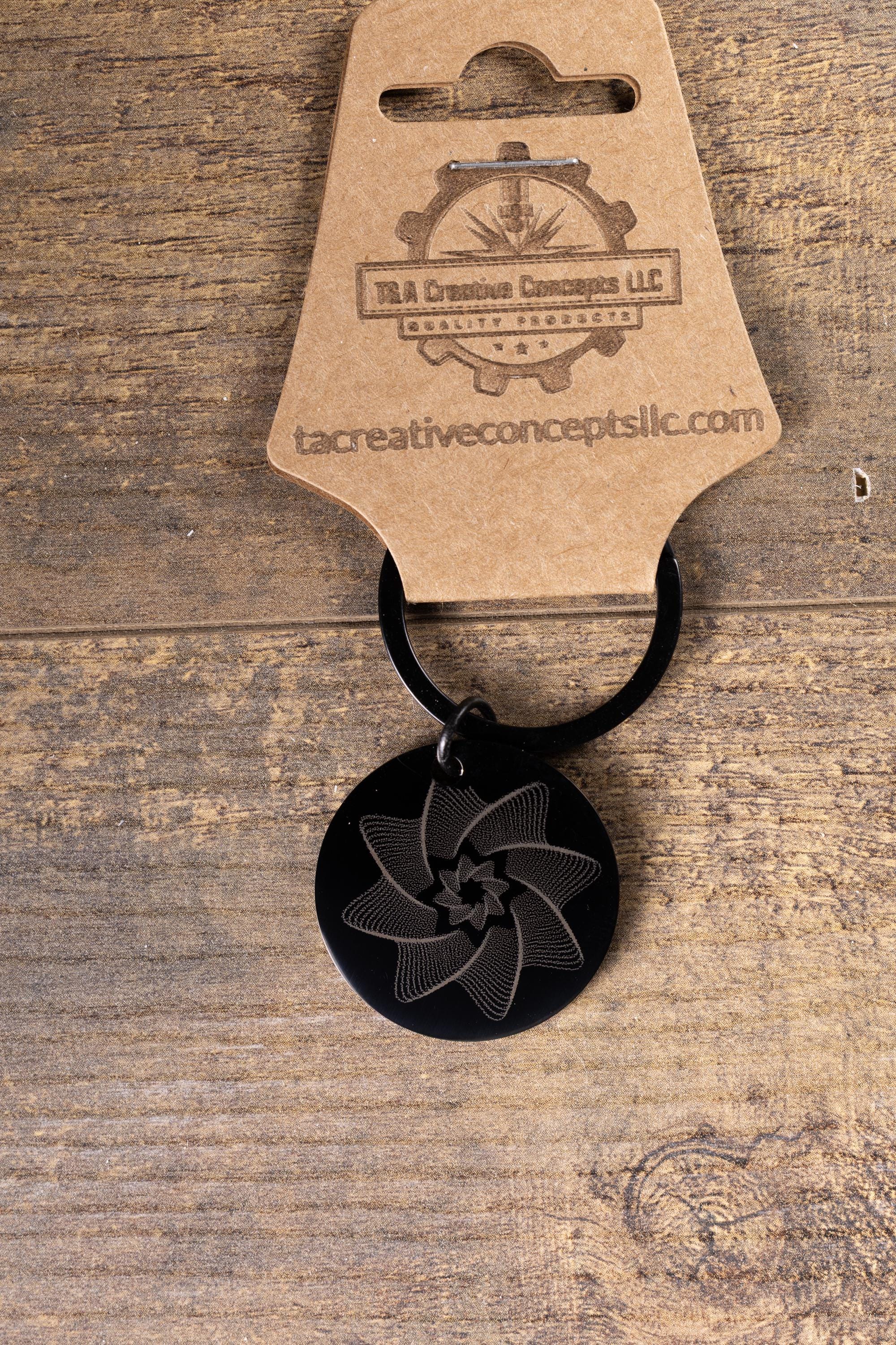 Black stainless steel spiral star keychain | laser engraved linework design both sides | modern celestial gift | durable key ring