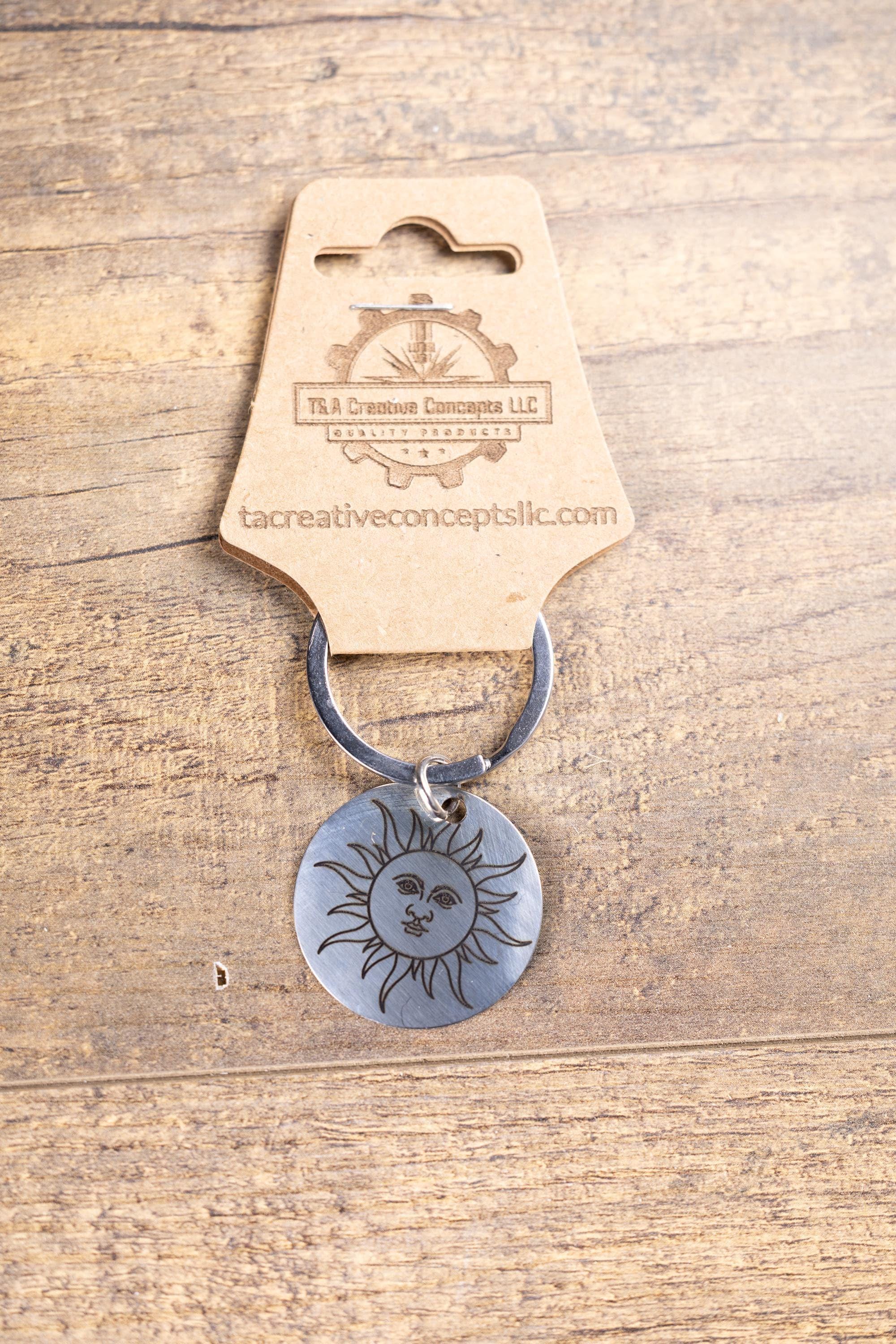 Polished stainless steel sun keychain | laser engraved celestial design | same image both sides | durable gift
