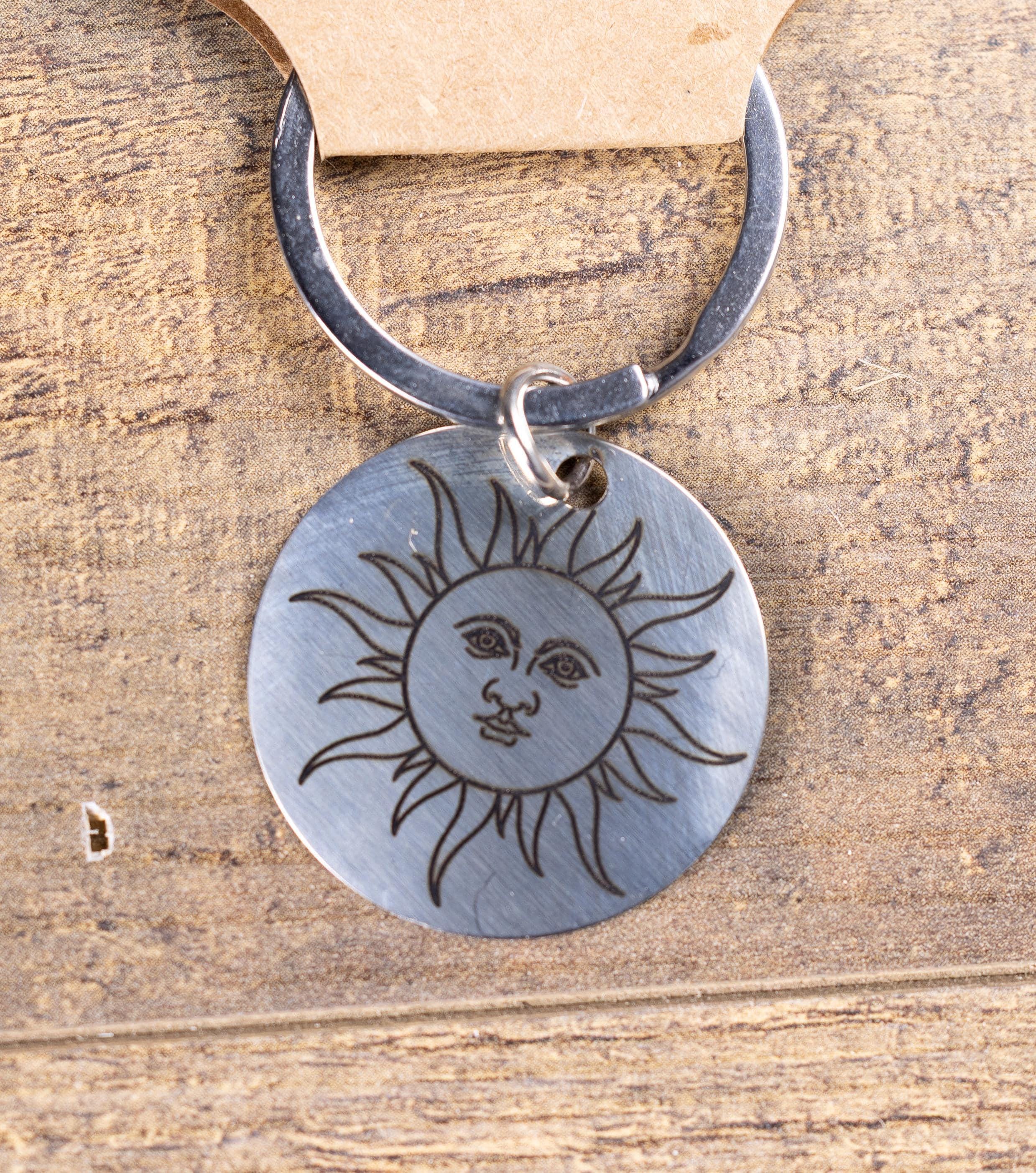 Polished stainless steel sun keychain | laser engraved celestial design | same image both sides | durable gift
