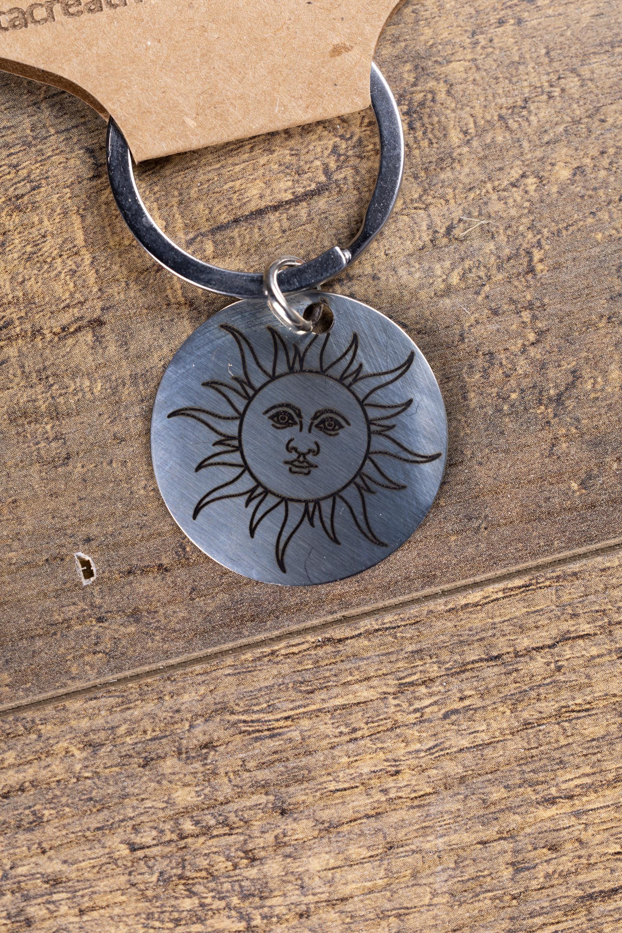 Polished stainless steel sun keychain | laser engraved celestial design | same image both sides | durable gift