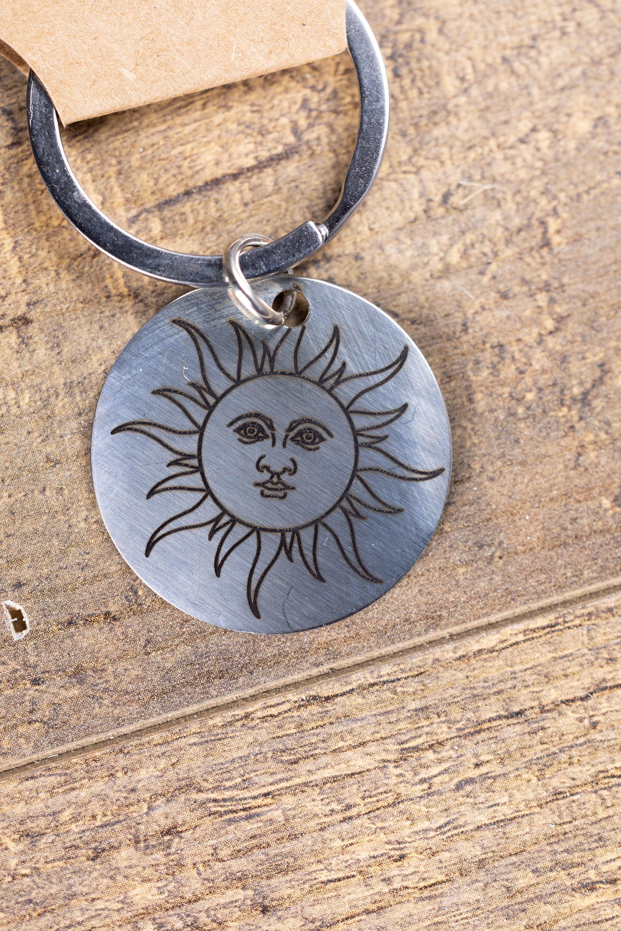 Polished stainless steel sun keychain | laser engraved celestial design | same image both sides | durable gift
