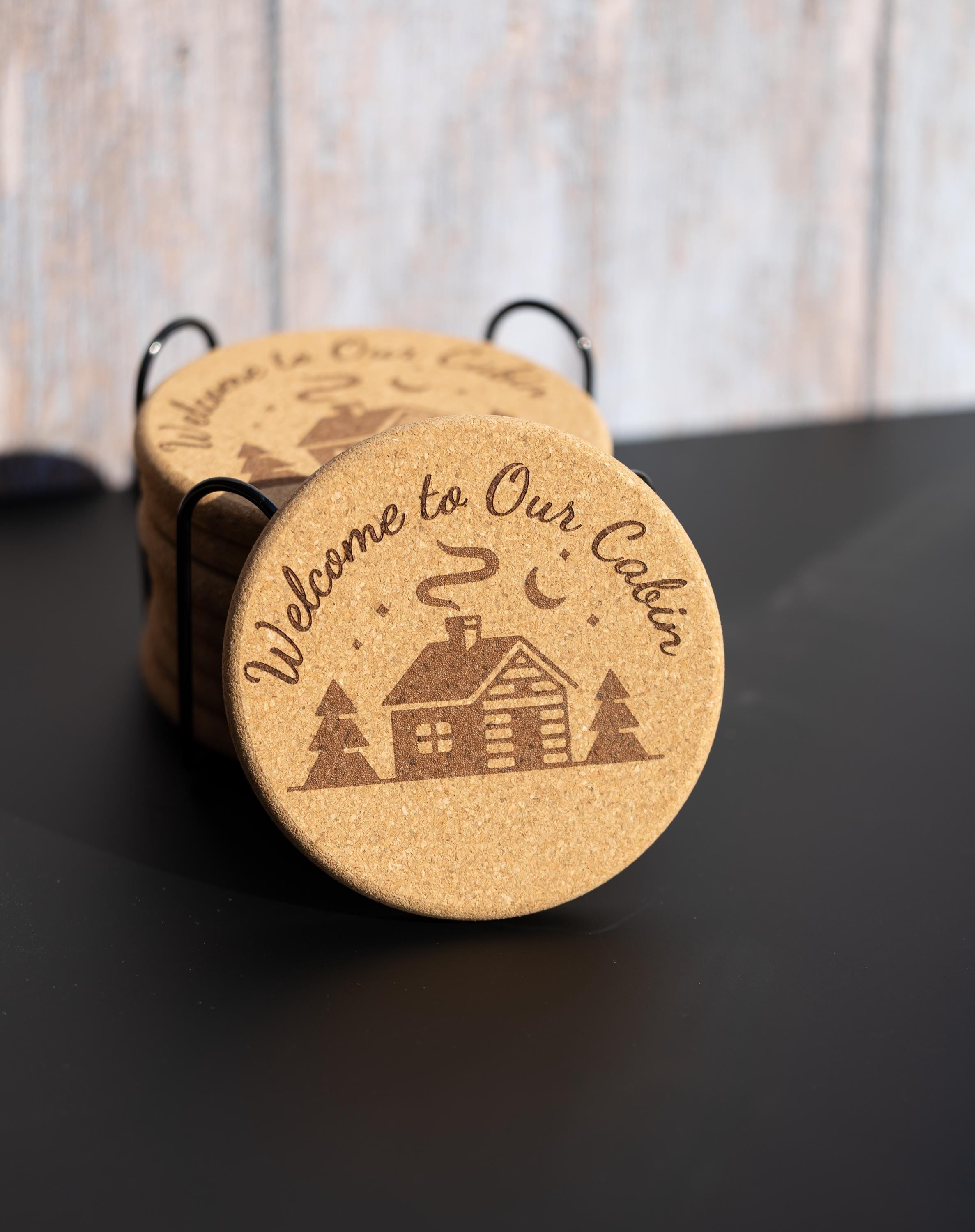 Laser engraved cabin cork coaster set: rustic welcome design