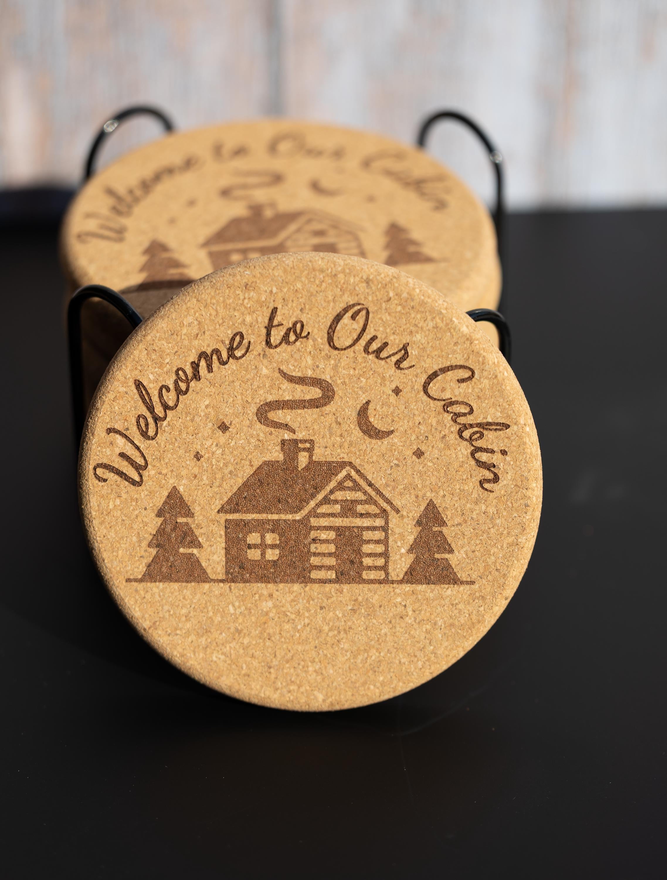Laser engraved cabin cork coaster set: rustic welcome design