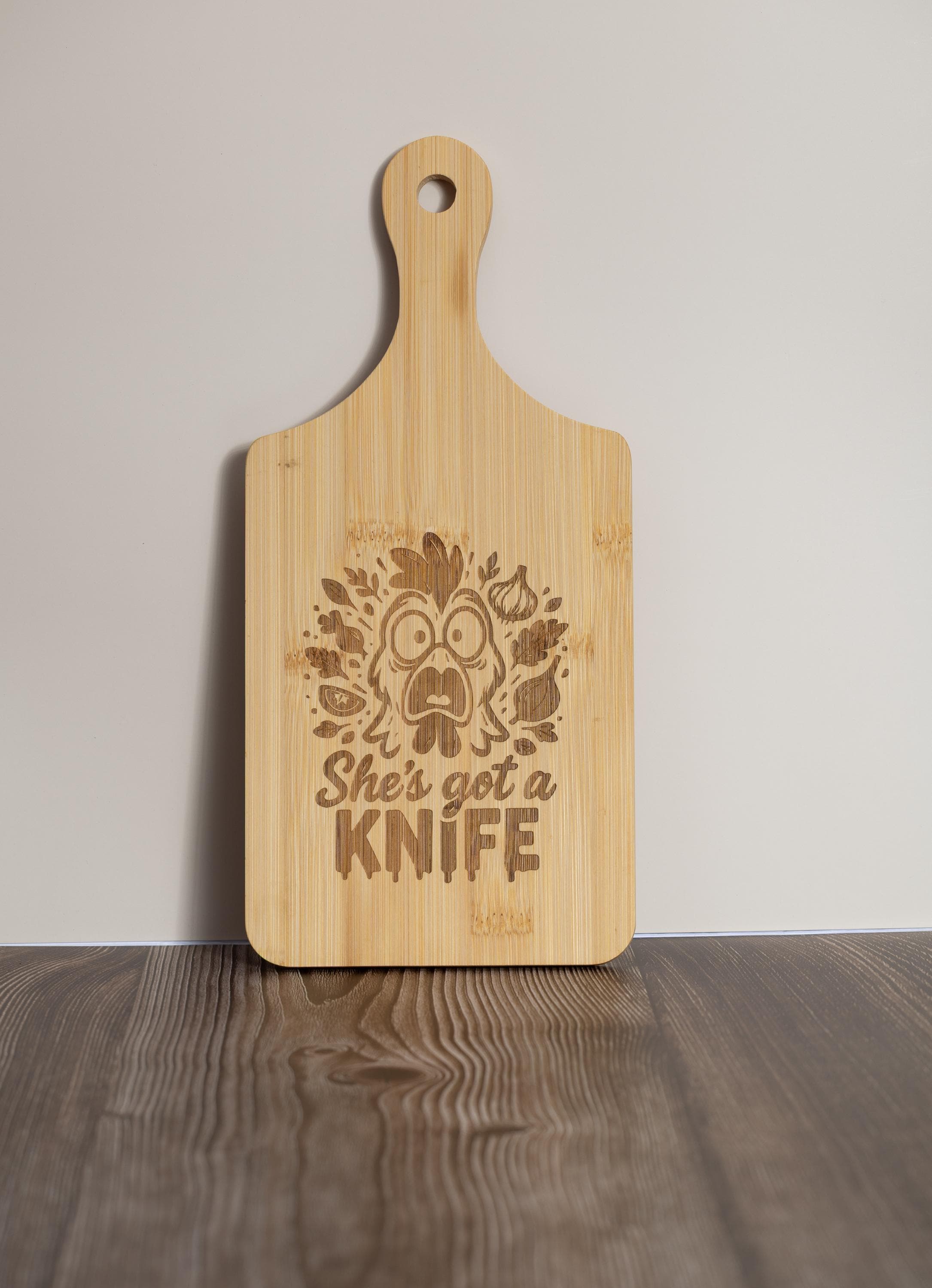 Funny laser engraved bamboo cutting board - "she's got a knife" kitchen decor (5"x11")