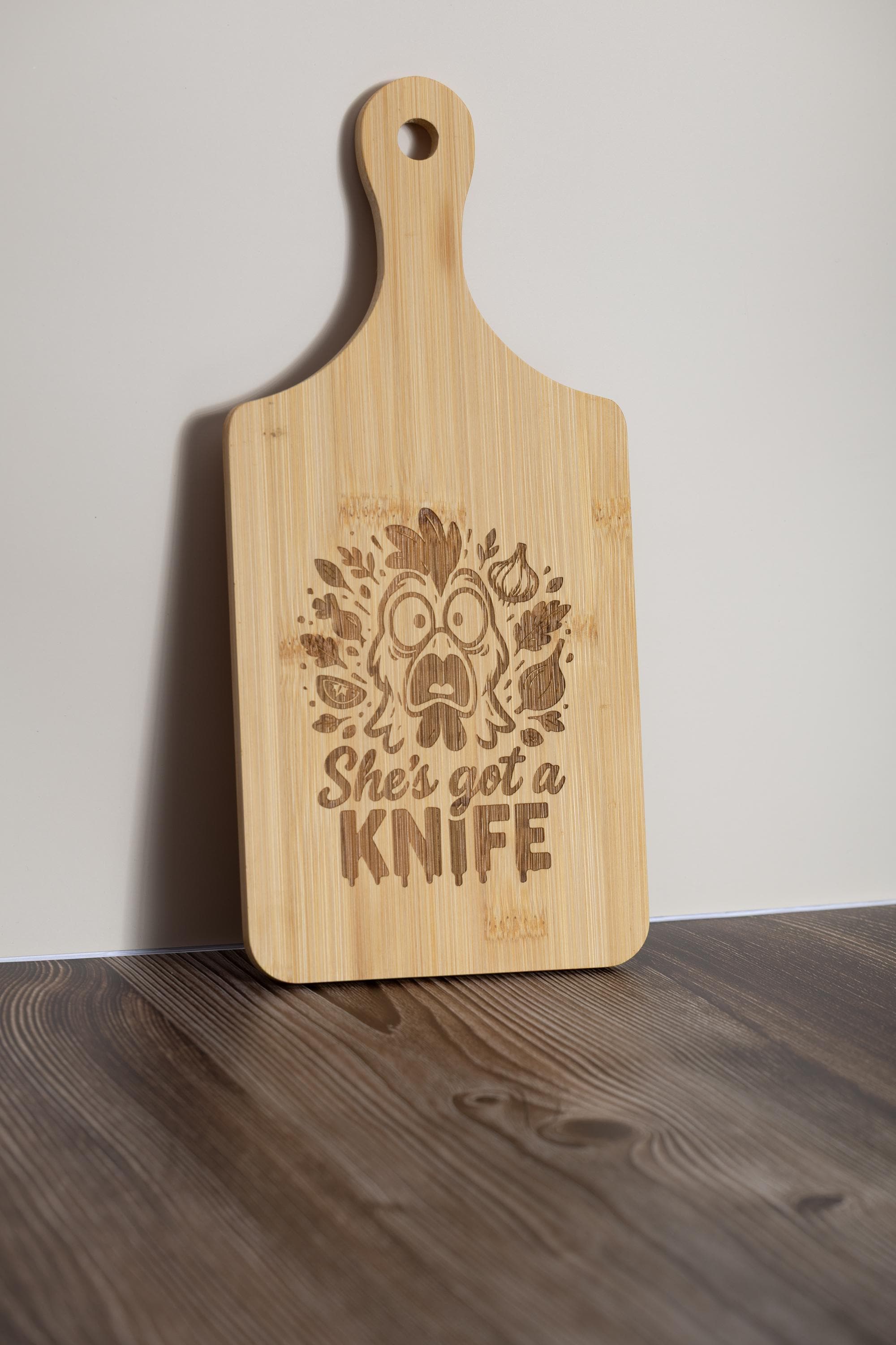 Funny laser engraved bamboo cutting board - "she's got a knife" kitchen decor (5"x11")