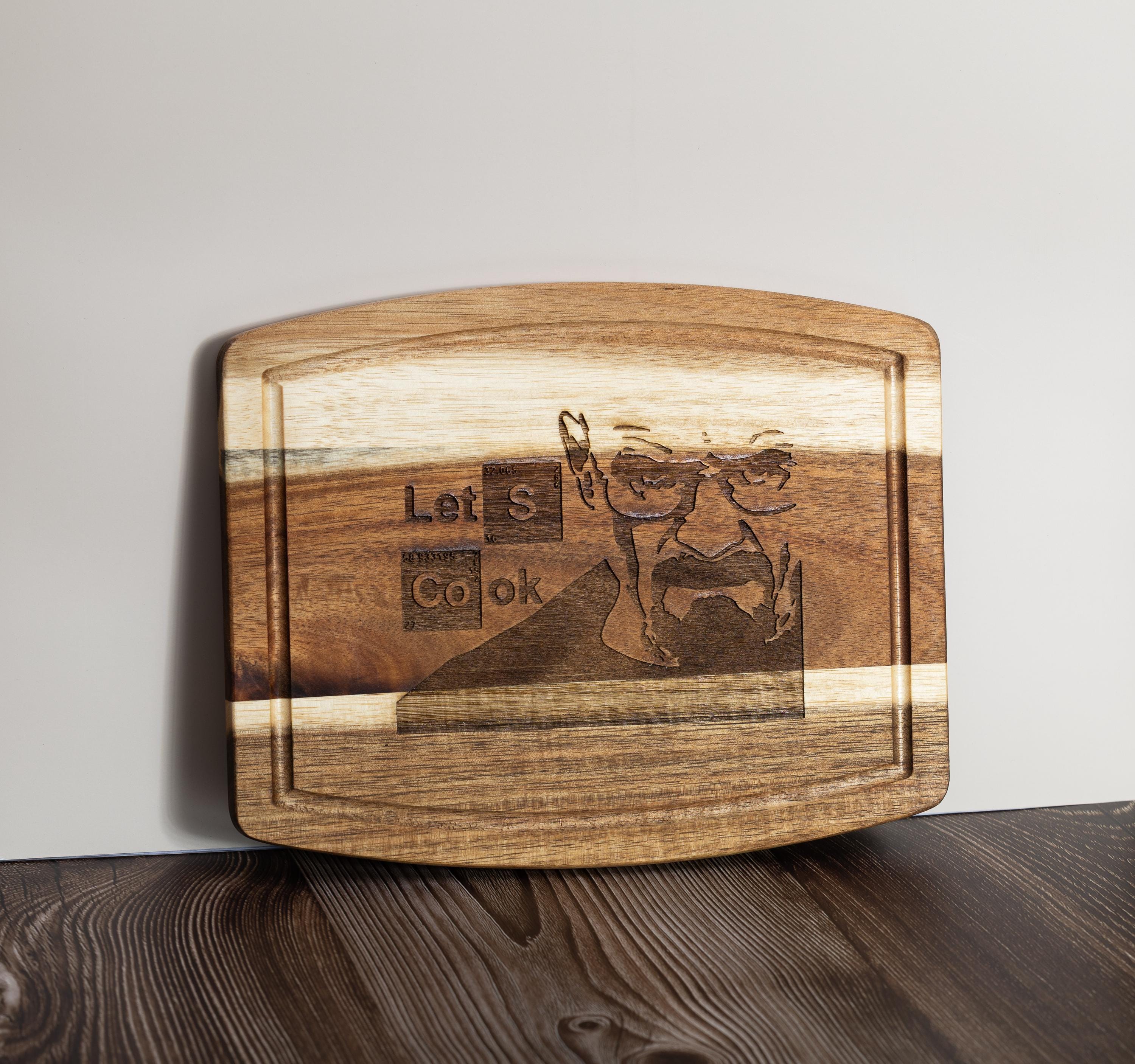 Breaking bad cutting board: acacia wood, laser engraved "let's cook"