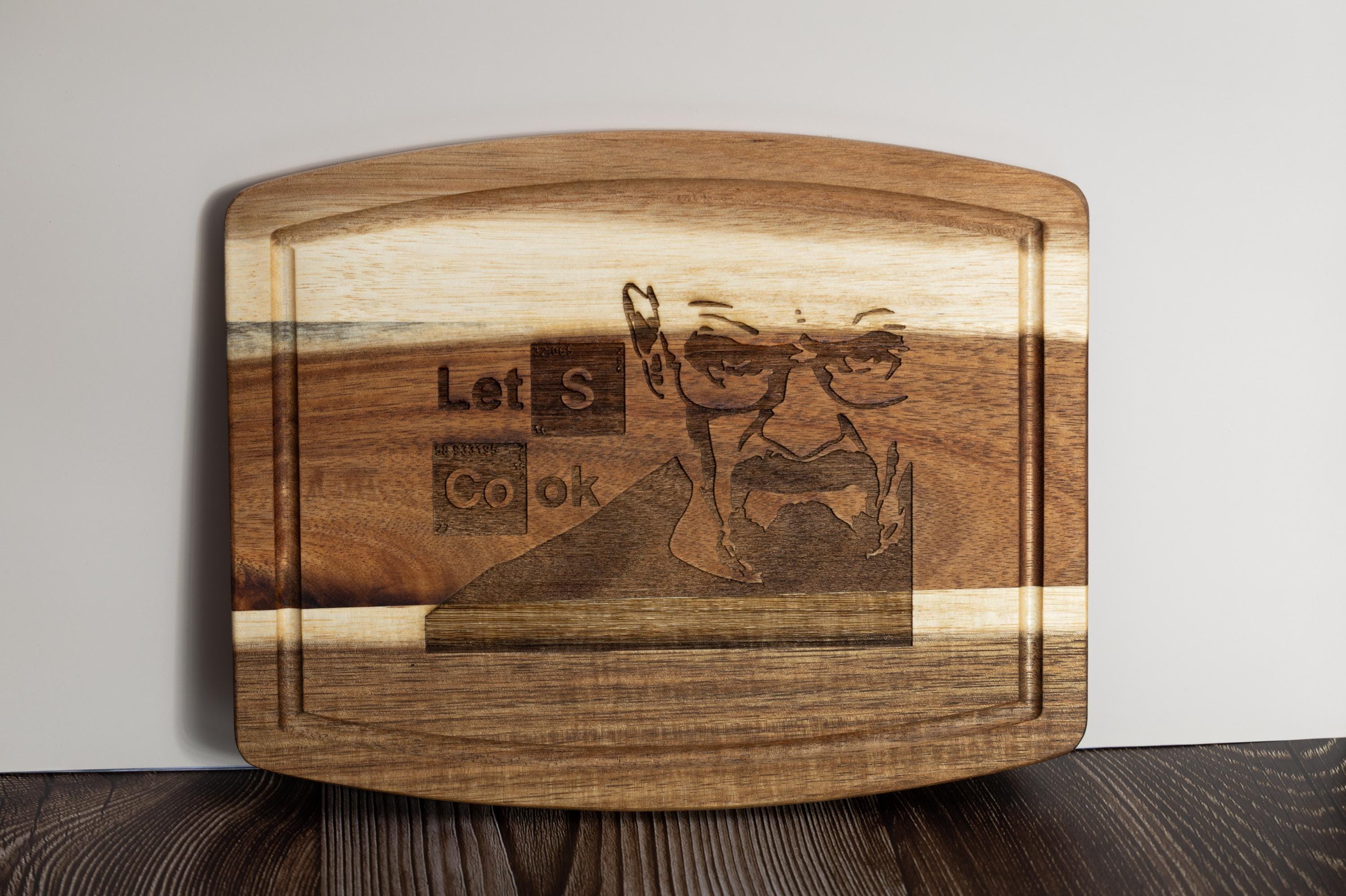 Breaking bad cutting board: acacia wood, laser engraved "let's cook"