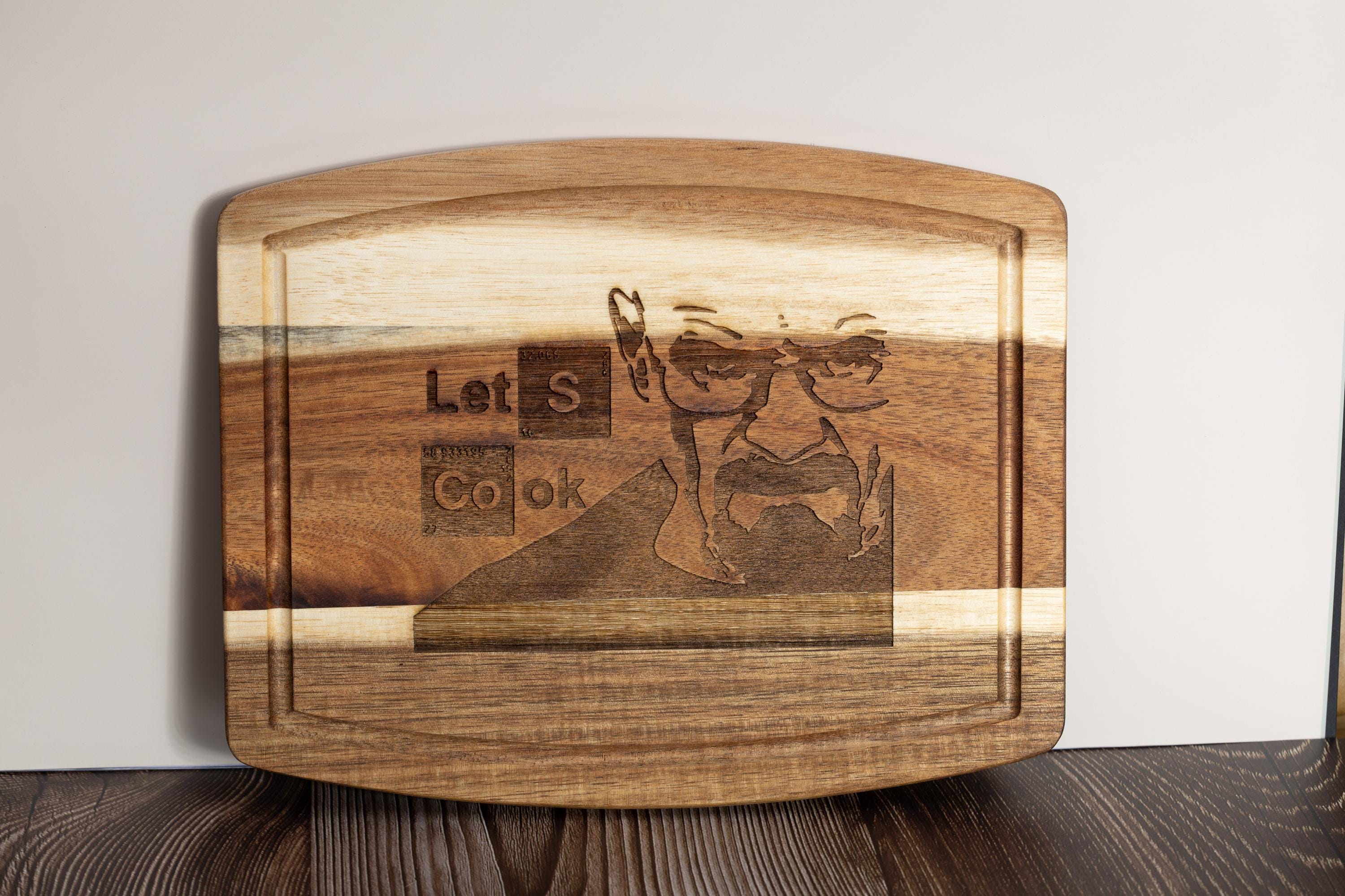 Breaking bad cutting board: acacia wood, laser engraved "let's cook"