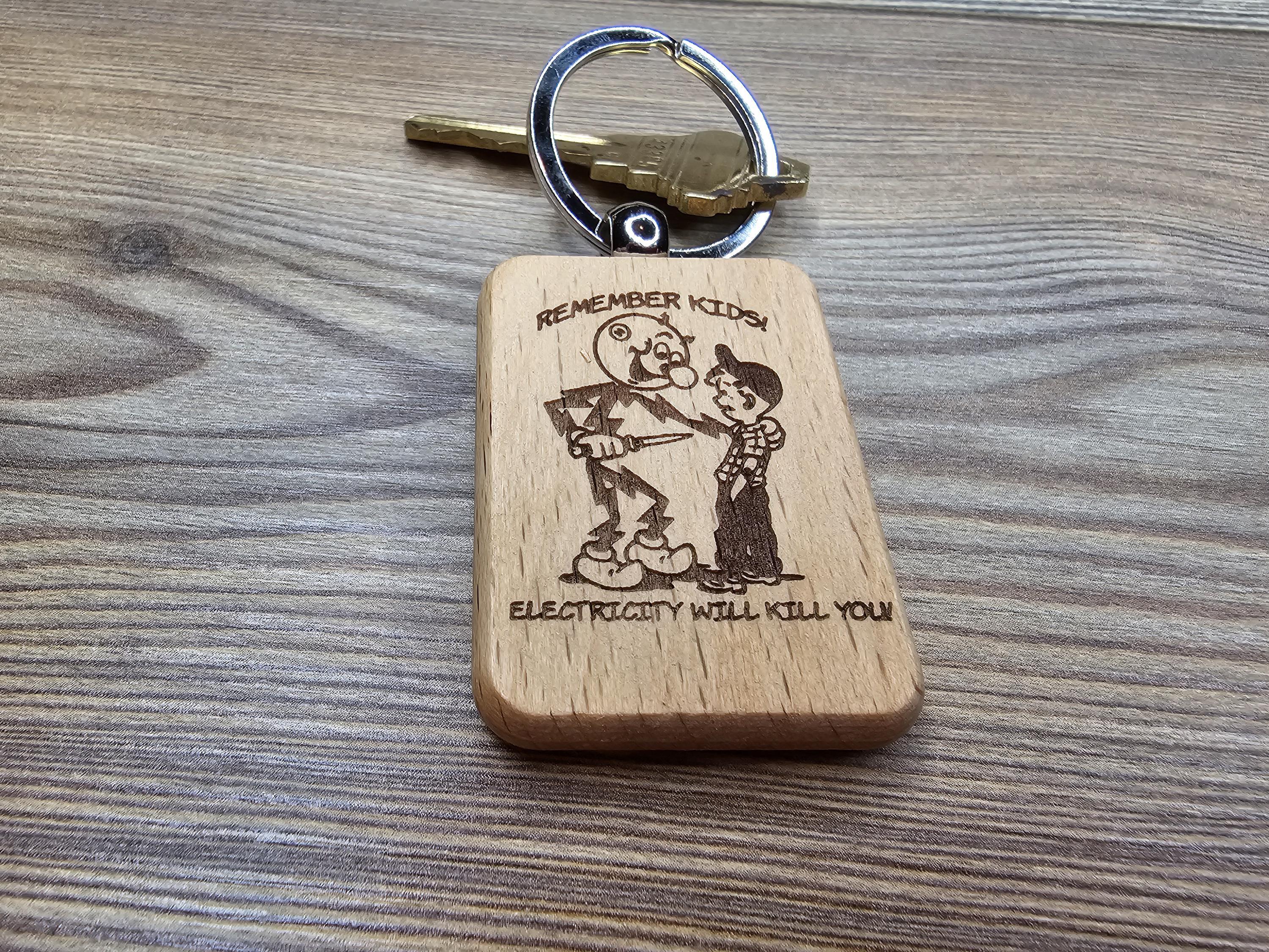 Electricity kills keychain / bag charm: laser engraved hardwood, stainless steel keyring