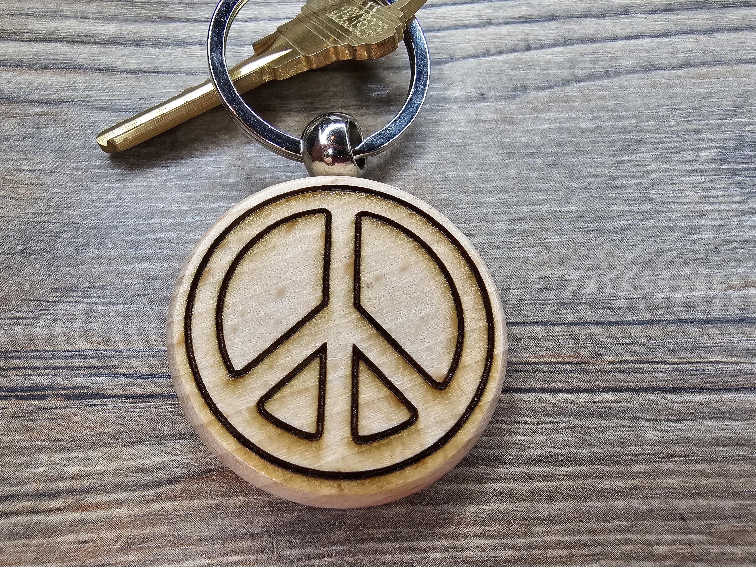 Laser engraved peace sign keychain / bag charm: hardwood with stainless steel keyring