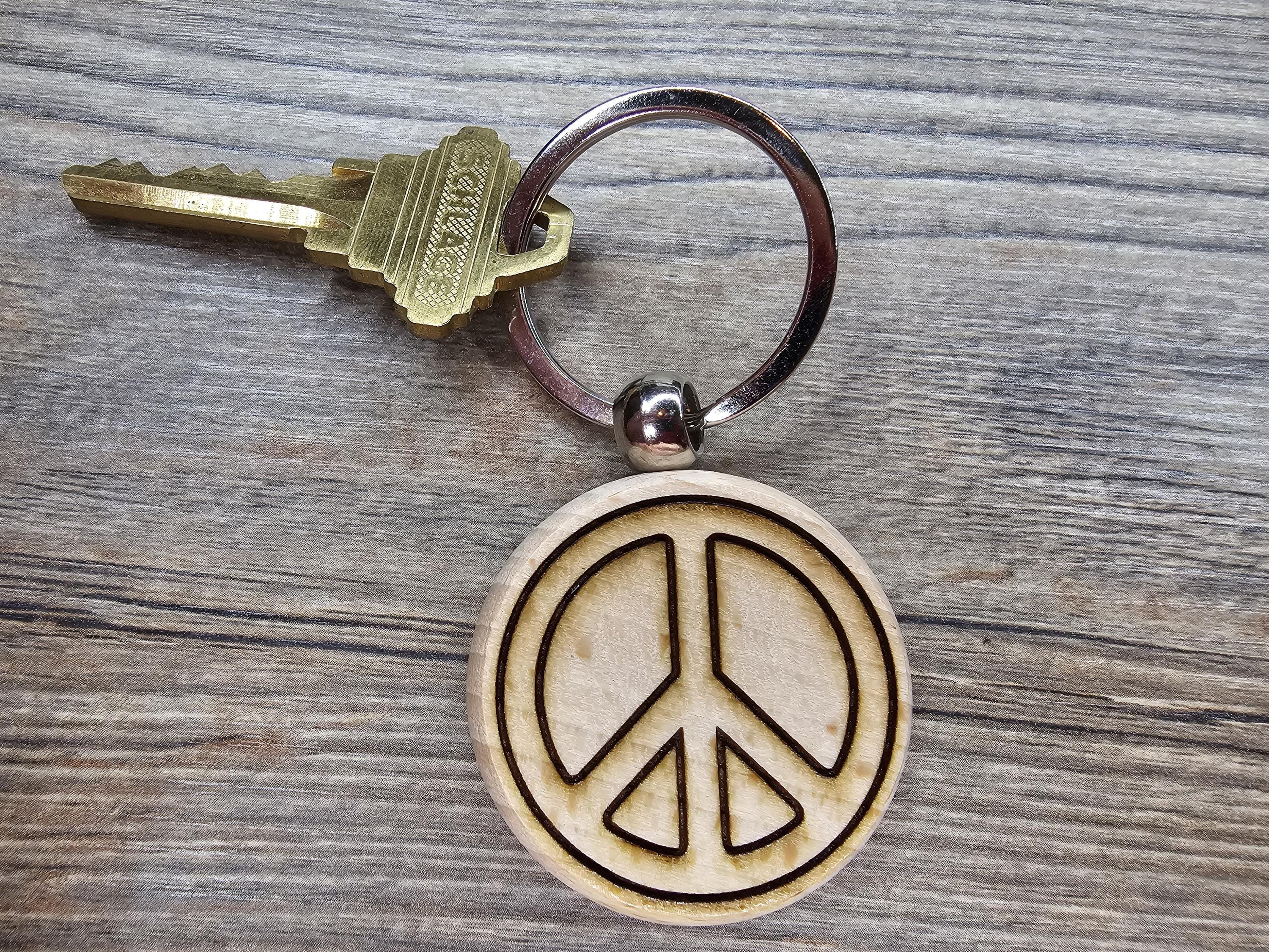 Laser engraved peace sign keychain / bag charm: hardwood with stainless steel keyring