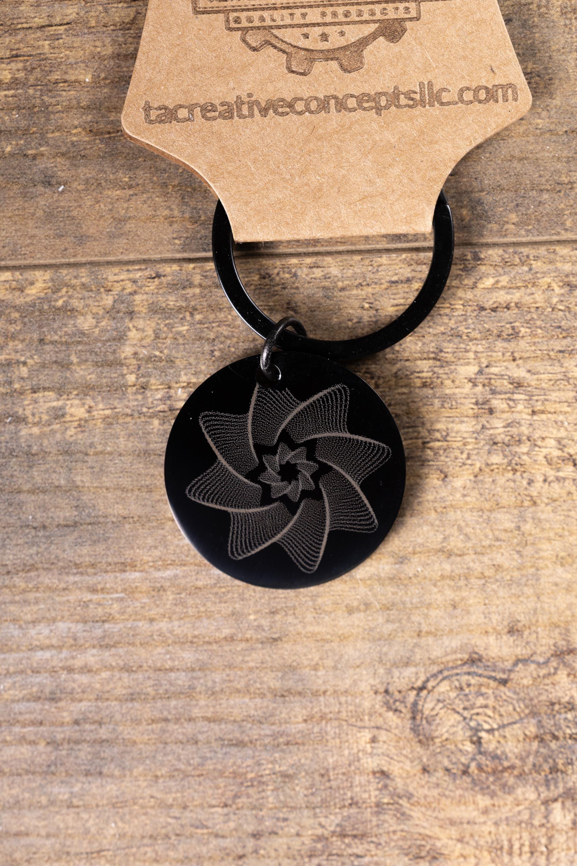 Black stainless steel spiral star keychain | laser engraved linework design both sides | modern celestial gift | durable key ring