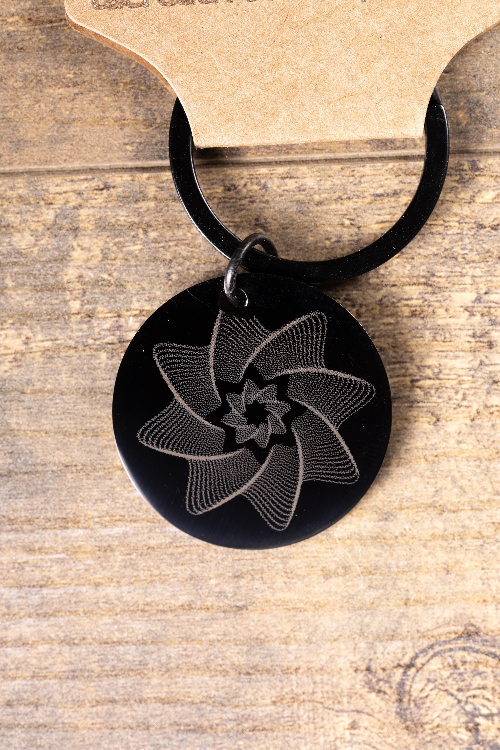Black stainless steel spiral star keychain | laser engraved linework design both sides | modern celestial gift | durable key ring