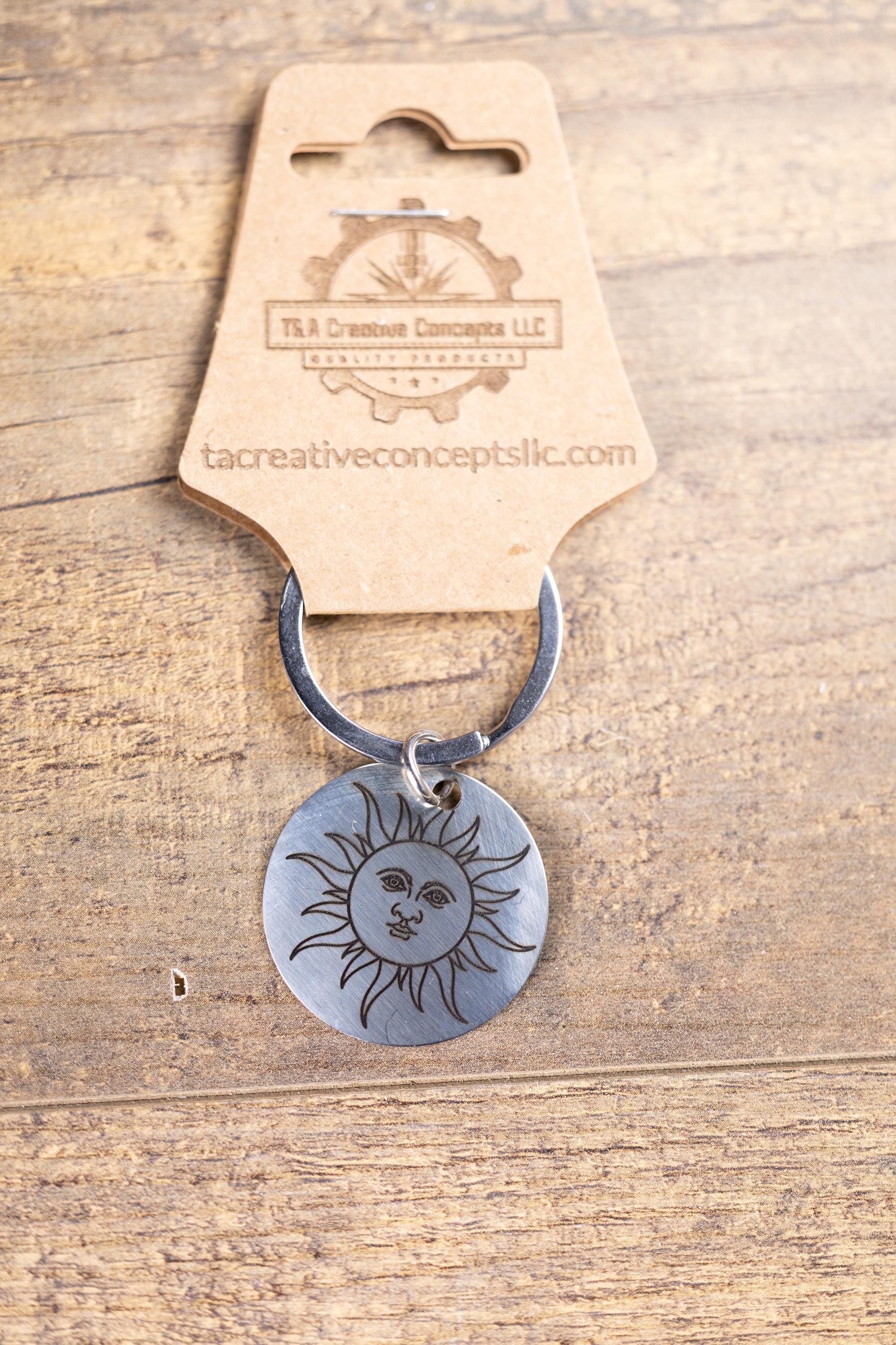 Polished stainless steel sun keychain | laser engraved celestial design | same image both sides | durable gift