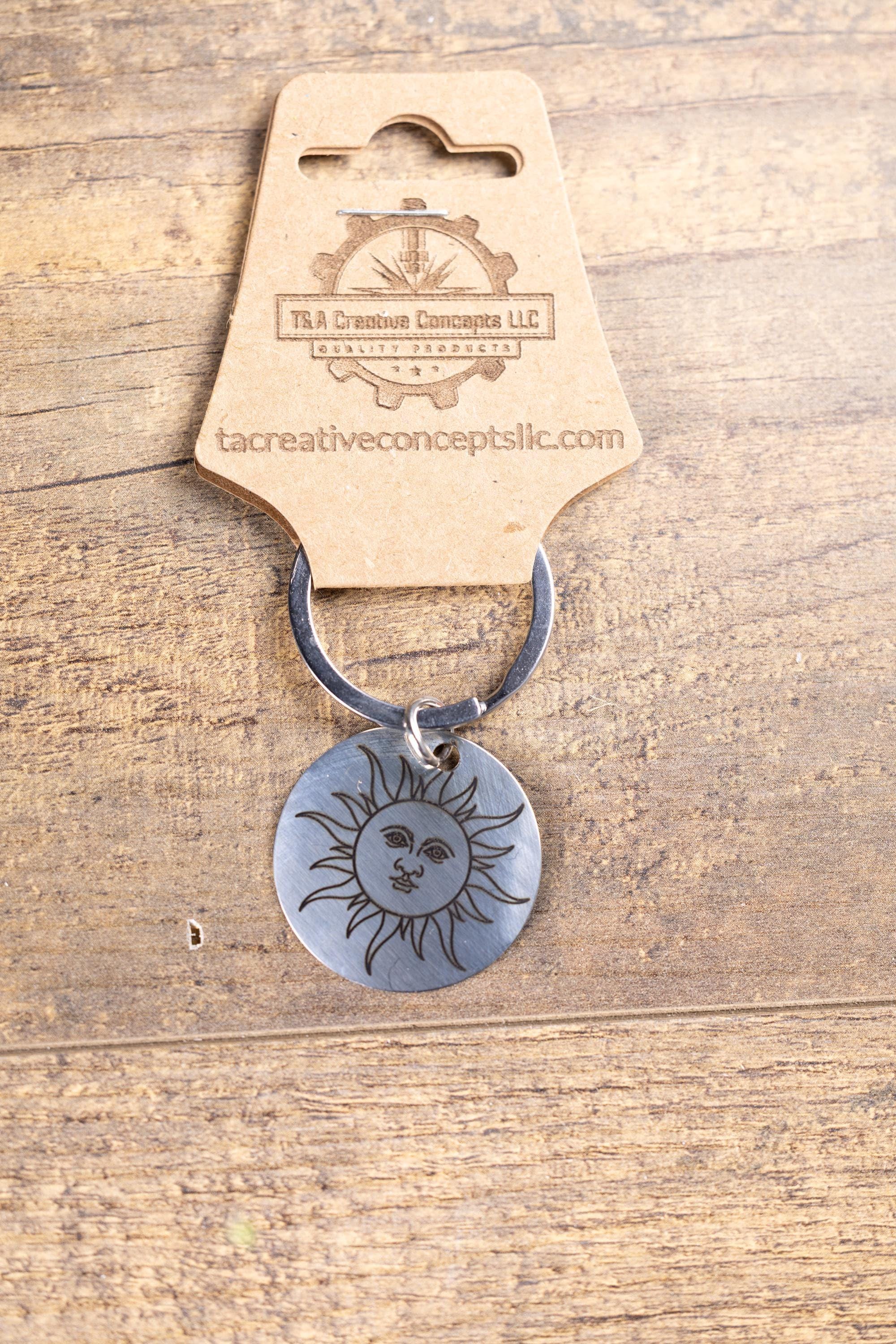 Polished stainless steel sun keychain | laser engraved celestial design | same image both sides | durable gift