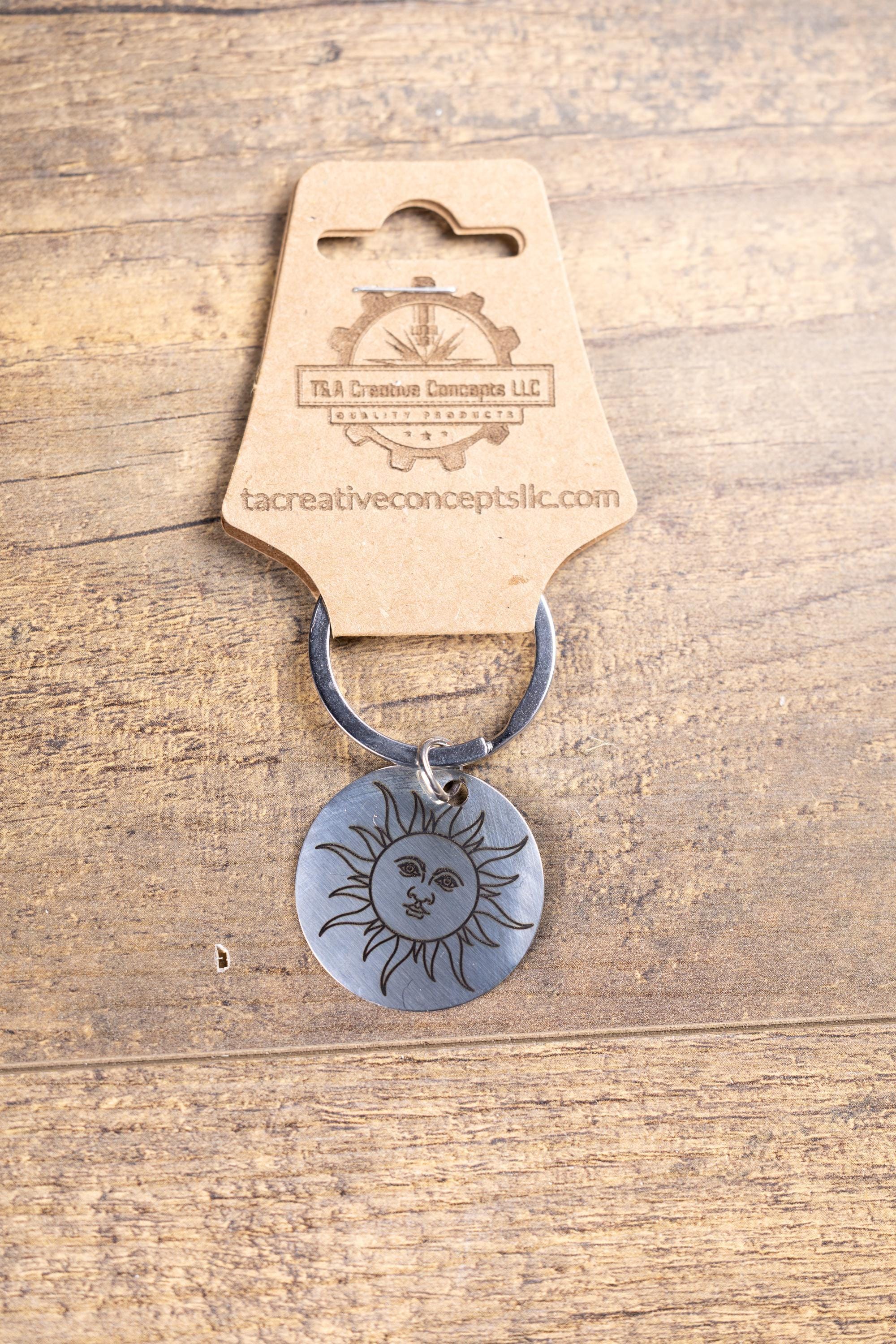 Polished stainless steel sun keychain | laser engraved celestial design | same image both sides | durable gift