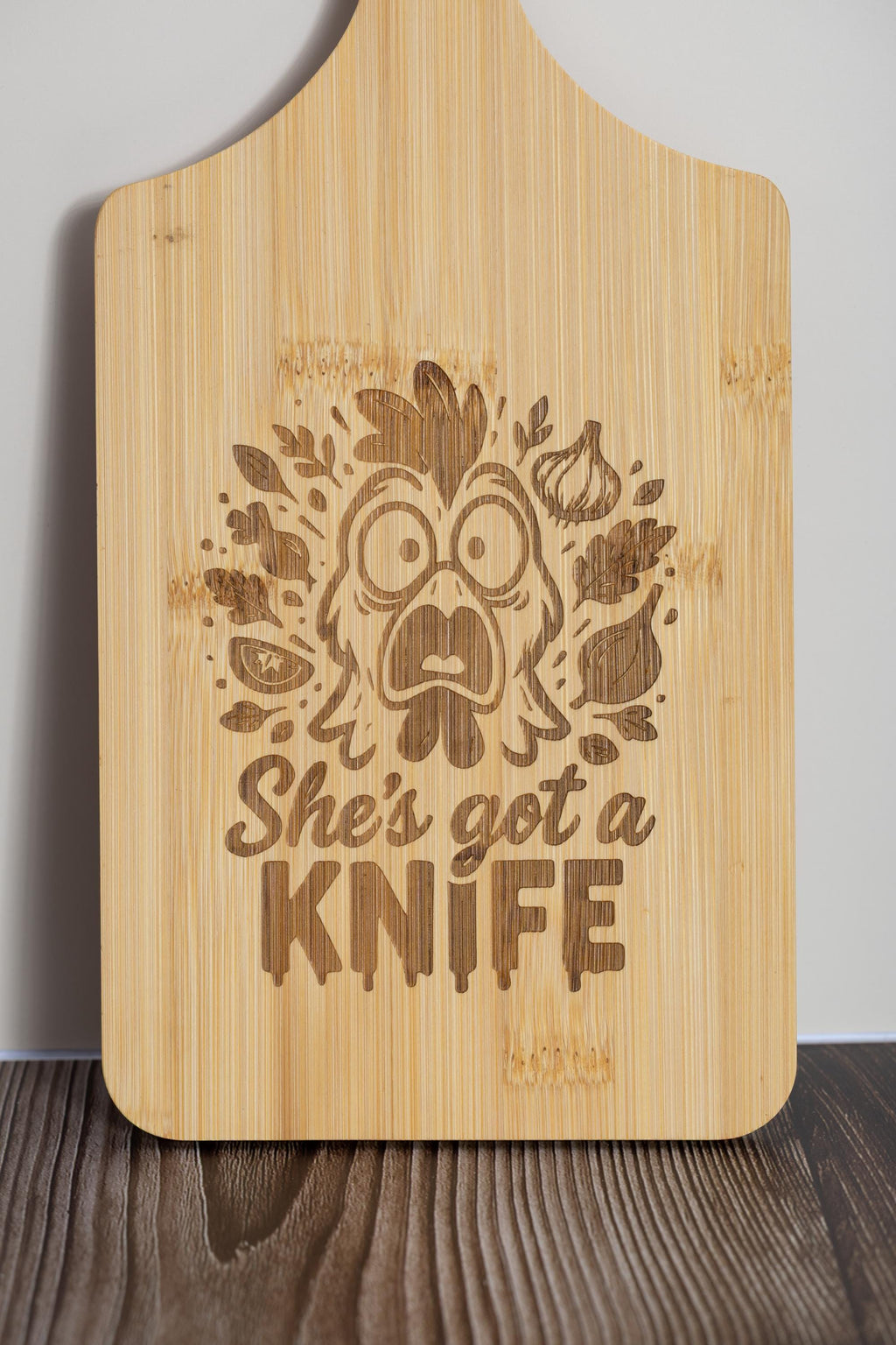Funny laser engraved bamboo cutting board - "she's got a knife" kitchen decor (5"x11")