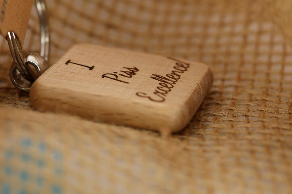 I piss excellence keychain: laser engraved hardwood, funny keychain gift