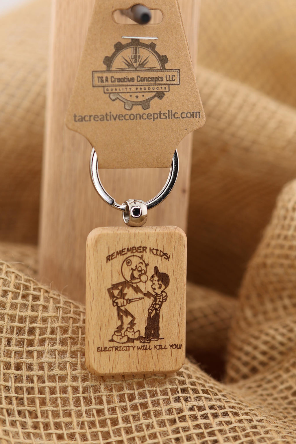Electricity kills keychain / bag charm: laser engraved hardwood, stainless steel keyring