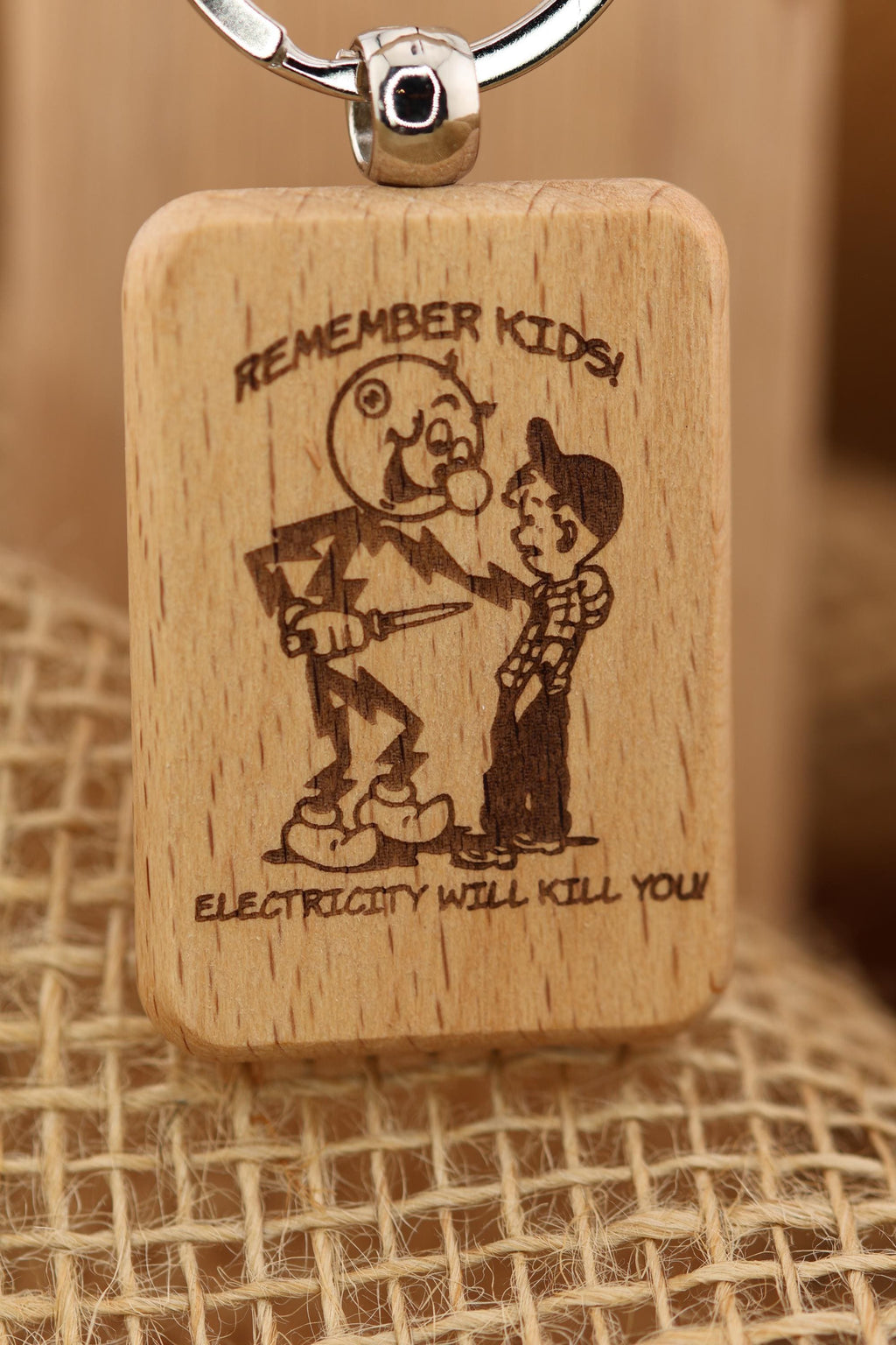 Electricity kills keychain / bag charm: laser engraved hardwood, stainless steel keyring
