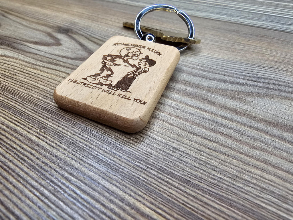 Electricity kills keychain / bag charm: laser engraved hardwood, stainless steel keyring