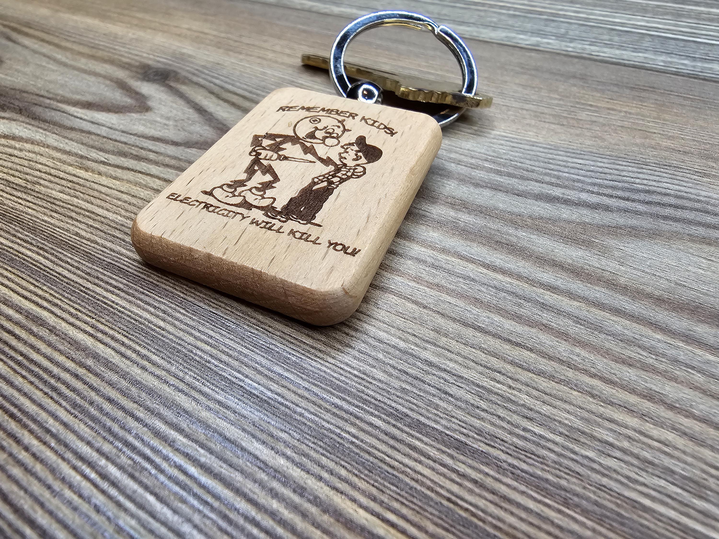 Electricity kills keychain / bag charm: laser engraved hardwood, stainless steel keyring
