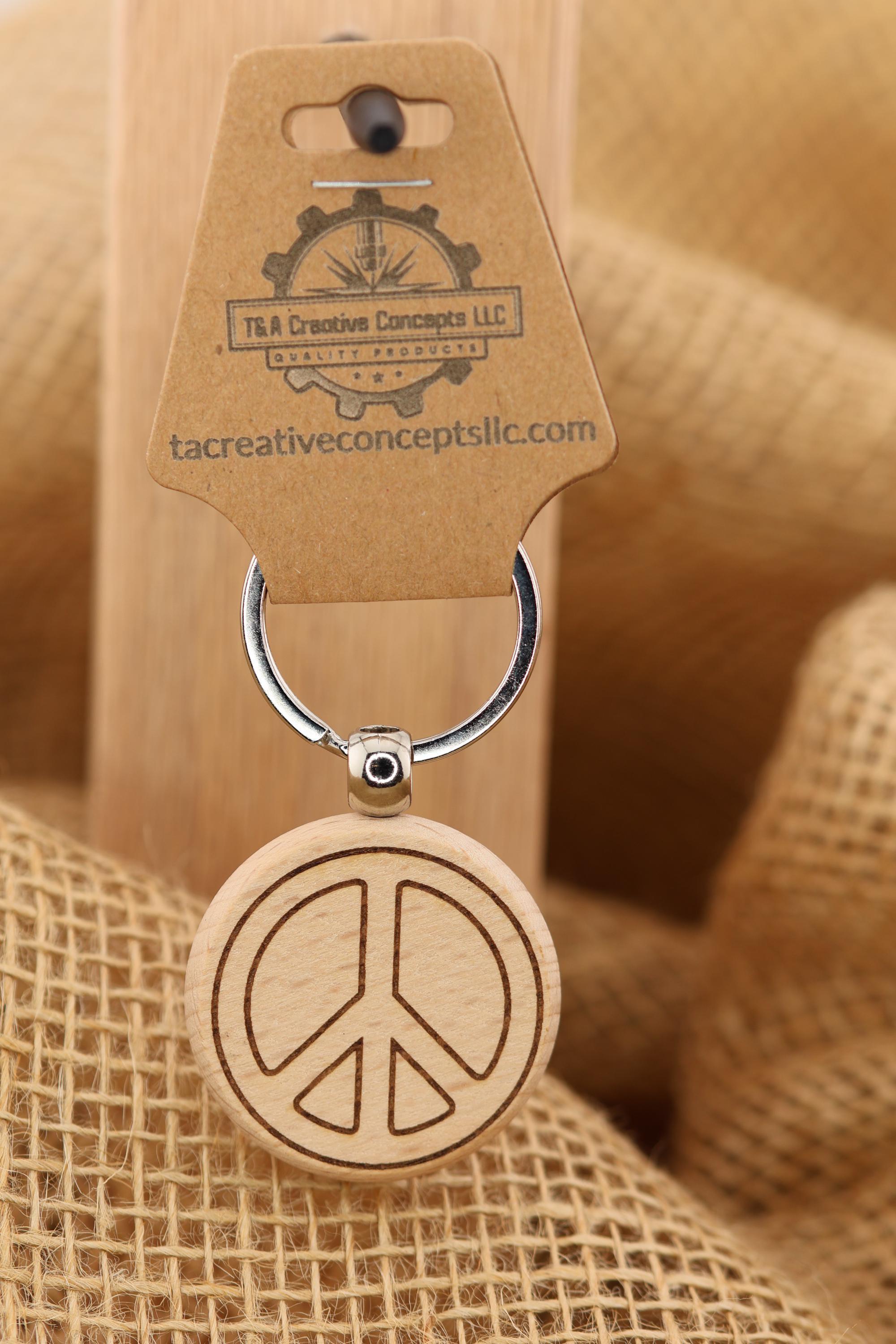 Laser engraved peace sign keychain / bag charm: hardwood with stainless steel keyring