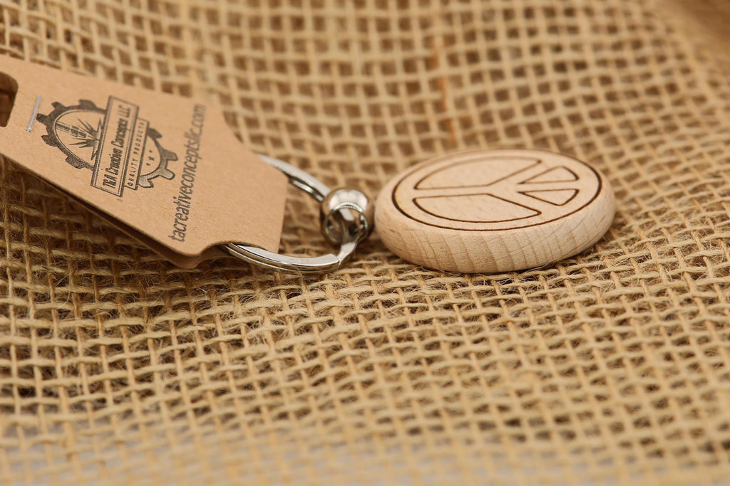 Laser engraved peace sign keychain / bag charm: hardwood with stainless steel keyring