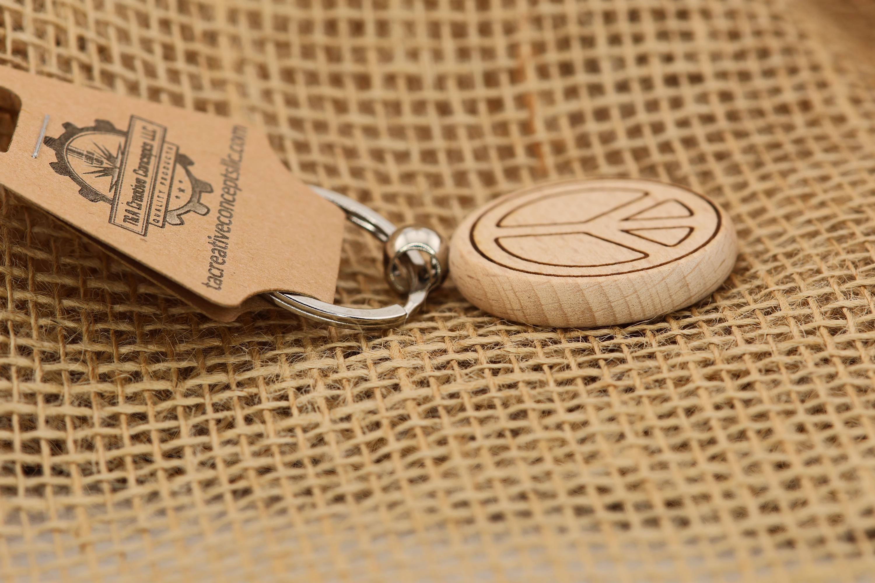 Laser engraved peace sign keychain / bag charm: hardwood with stainless steel keyring